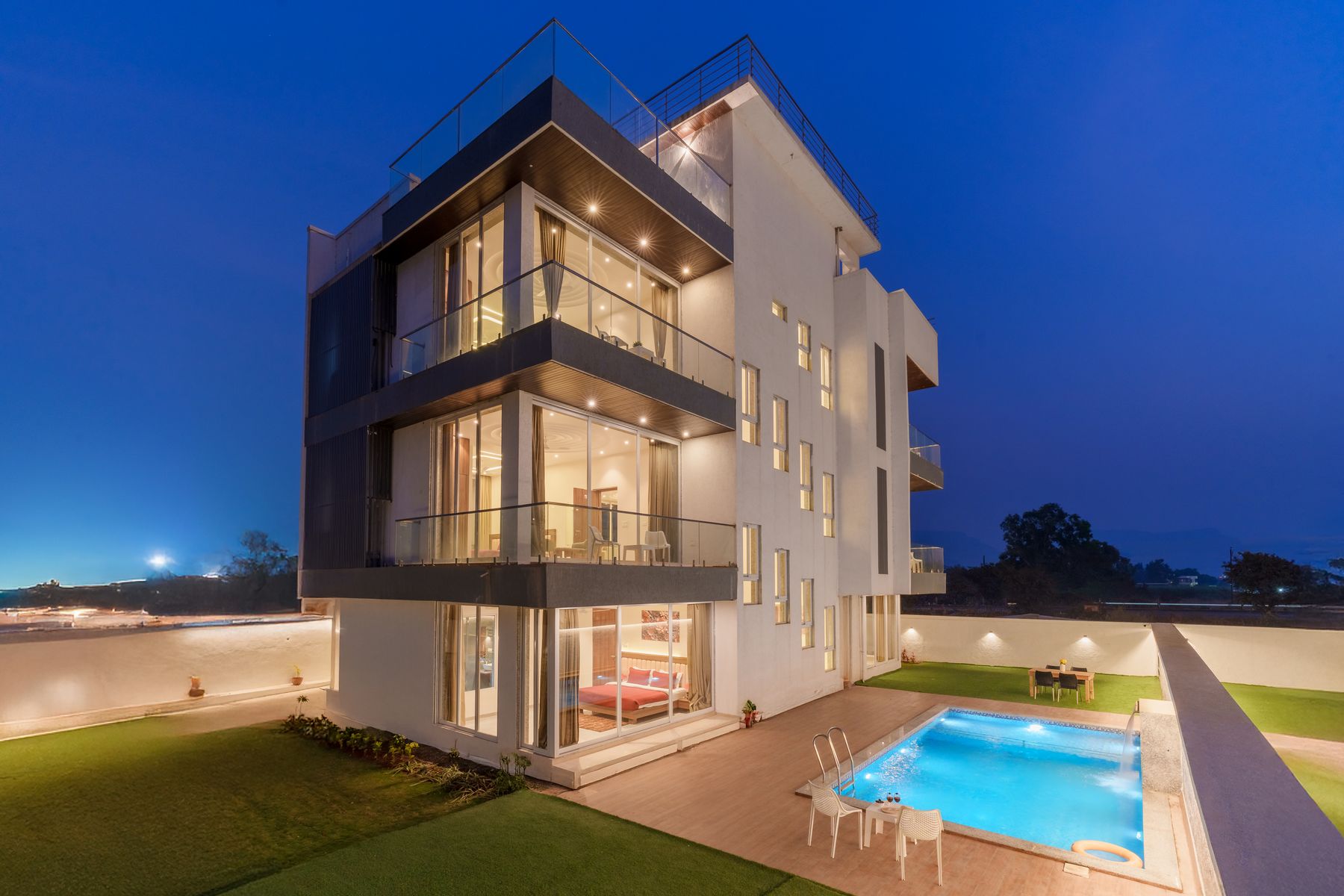 Licensed real photograph of a modern luxury villa at twilight