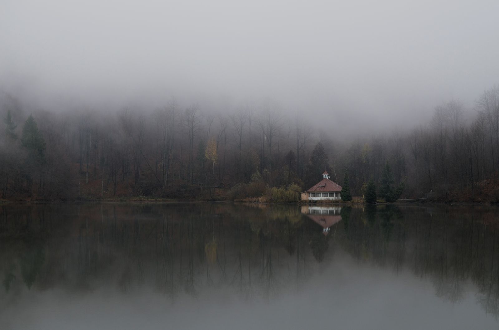 Licensed real photograph of a lakeside cabin vacation retreat